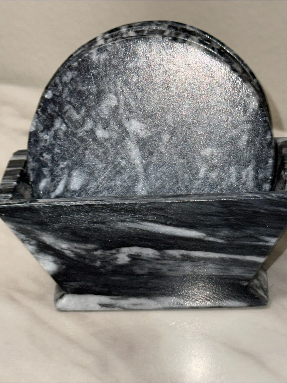 5 round hard rock black marble color coasters in holder